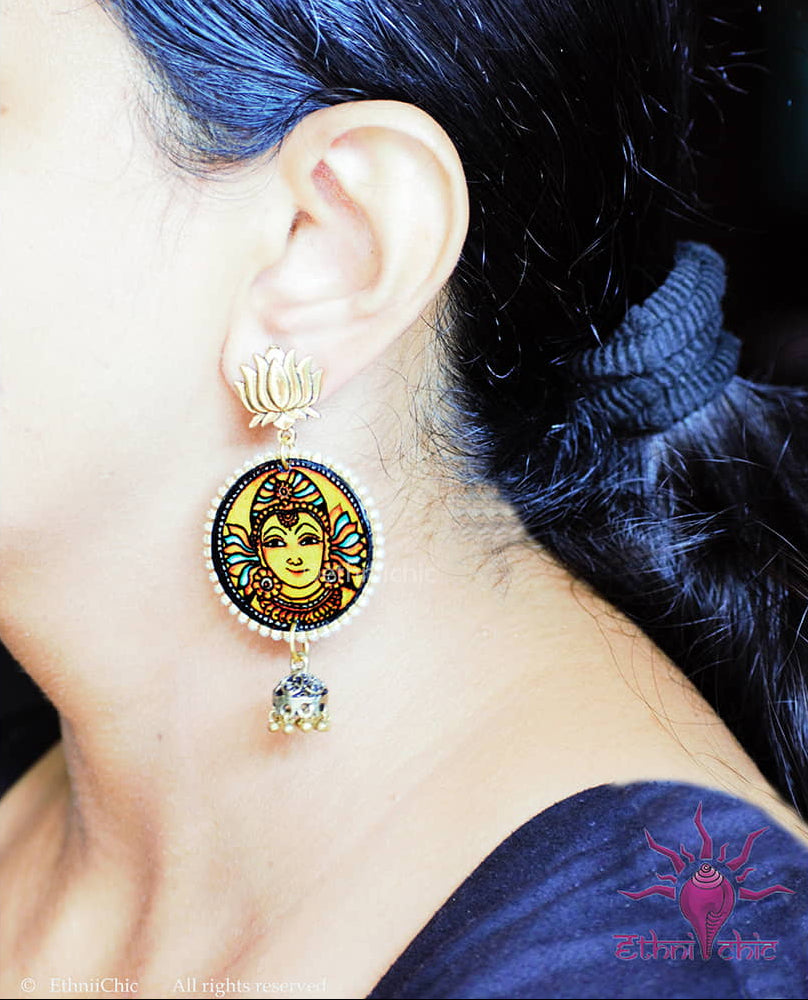 Close-up of a woman wearing the Kerala Mural Hand-Painted danglers with Yellow Mural Yellow small size