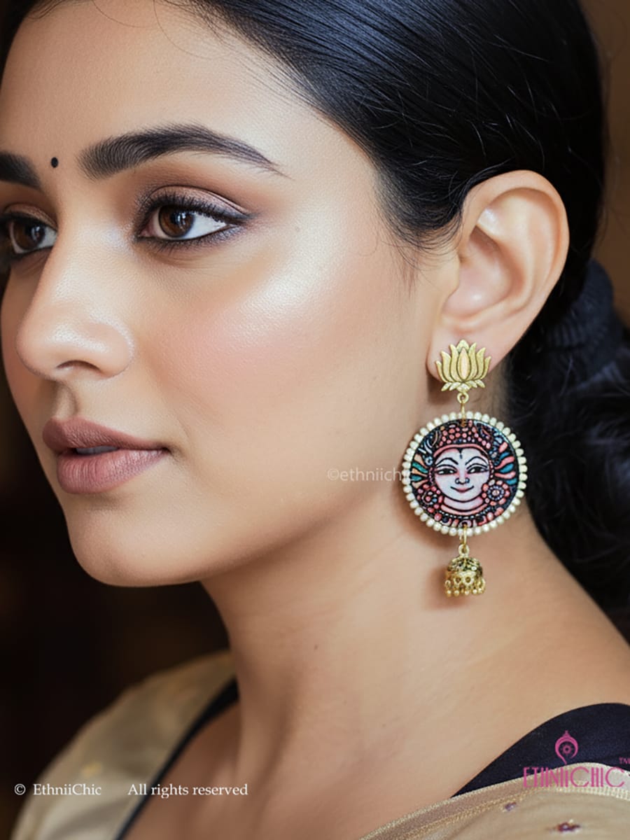 Close-up of a woman wearing the Kerala Mural Hand-Painted Earrings – Apsara