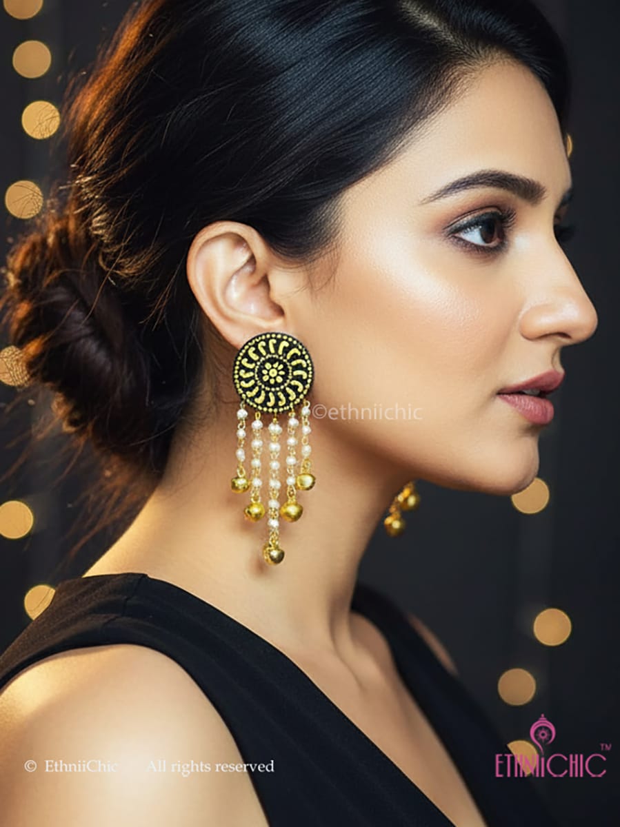 Woman wearing Hand-painted Mandala Earrings, hand-painted earring with a dark background  | EthniiChic
